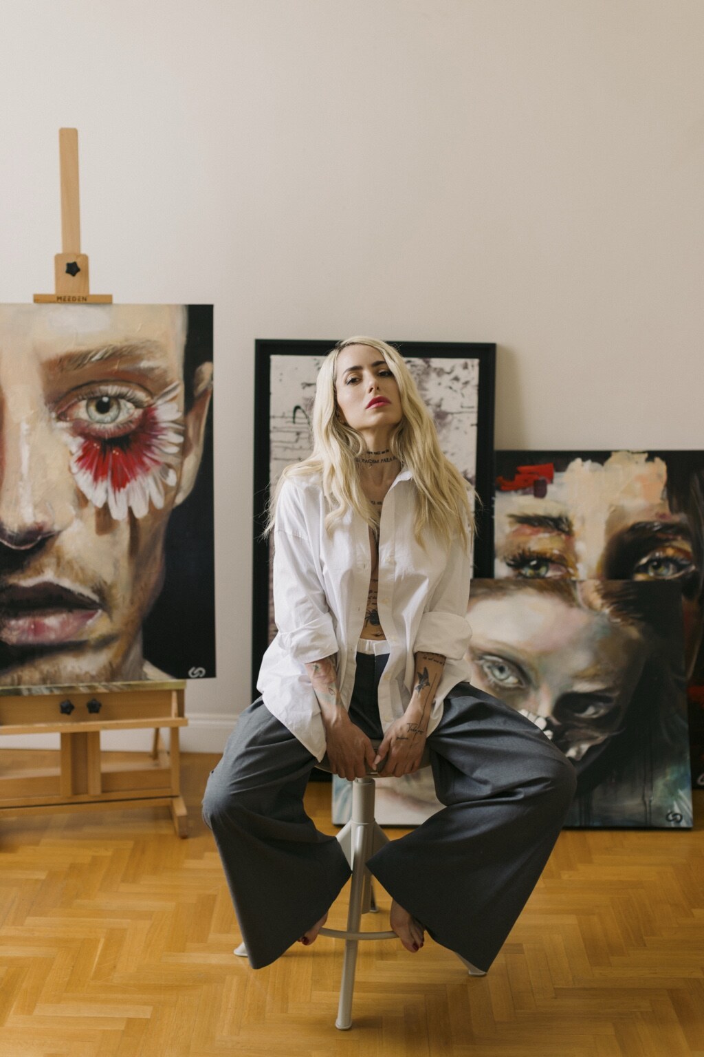 Vanessa Patitucci with her paintings